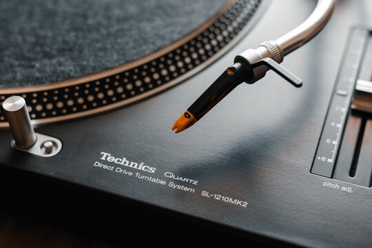 Closeup of iconic technics 1210 mk2 turntables with ortofon nightclub mk2 needle