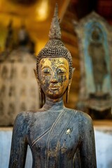 Ancient Buddha statue at Wat Visoun in Luang Prabang, Laos, Southeast Asia