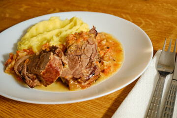 Roasted pork meat on white plate