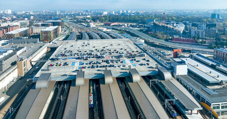 Main railway station (Krakow Glowny) in Krakow, Poland, with a big parking lot on the roof, cars,...