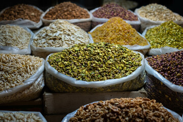 Bag of pistachios and nuts for sale on snack market, Suq 