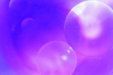 Oil bubbles close up. circles of water macro. abstract light blue background