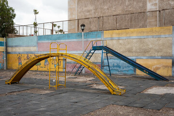 run down slide on old playground, Damascus, Syria