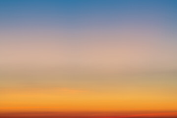 The dramatic colors of the sunset in the sky gradient from blue to orange.
