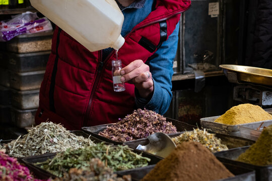 Vendor at spice , herb, perfume and oil store in souq, Damascus, Syria