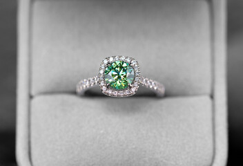 Emerald ring with diamonds in box