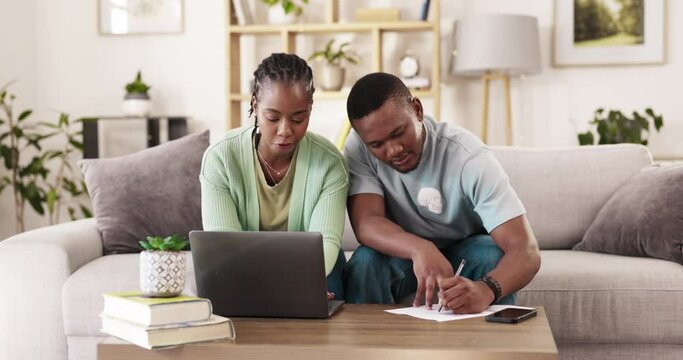 Paperwork, laptop or couple working on financial budget, savings plan or payment of bank account bills. Black woman, man or people writing taxes, mortgage or home accounting for online finance review