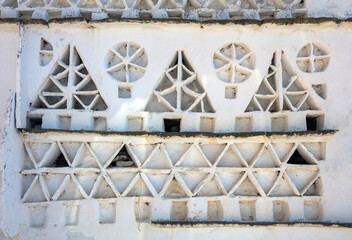 Tinos island, Cyclades. Traditional old dovecote, white traditional pattern pigeons house background.