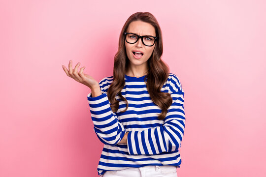 Photo of young dissatisfied woman wear sailor style striped shirt argue conflict with colleagues stress isolated on pink color background