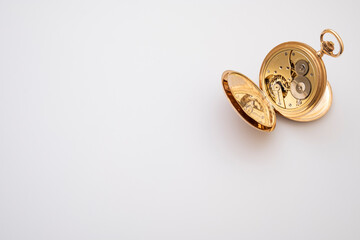 vintage gold pocket watch longines isolated on white background