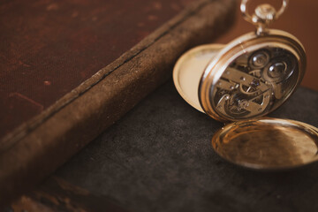 vintage gold pocket watch longines isolated on white background