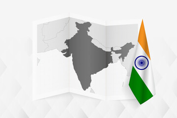 A grayscale map of India with a hanging Indian flag on one side. Vector map for many types of news.