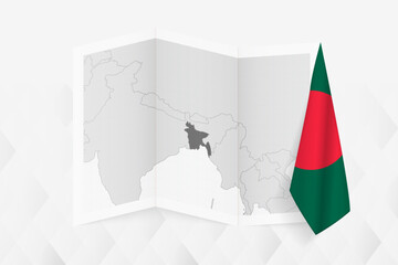 A grayscale map of Bangladesh with a hanging Bangladeshi flag on one side. Vector map for many types of news.