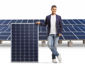 Casual man leaning on a solar panel and smiling