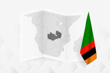 A grayscale map of Zambia with a hanging Zambian flag on one side. Vector map for many types of news.