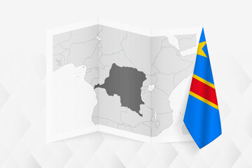 A grayscale map of DR Congo with a hanging DR Congolese flag on one side. Vector map for many types of news.