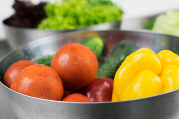 Fresh washed vegetables in metal plate