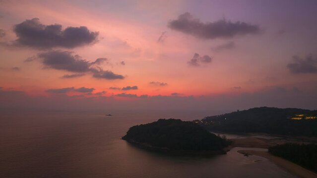 aerial hyperlapse view scenery sky in twilight above Kala island Layan beach Phuket..stunning sky at twilight at Kala island is at the endwise of Layan beach.Scene of Colorful romantic sky background.