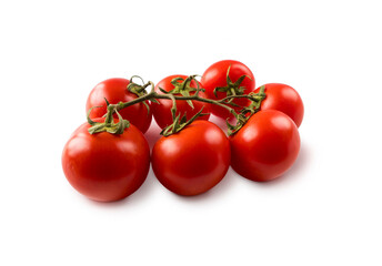 Red tomatoes lay on white background. Ripe tomatoes isolated on a white background. Brush of ripe tomatoes on white.