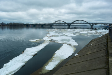 A flooded pier with an ice jam during the spring floods of the Volga. A beautiful view of the...