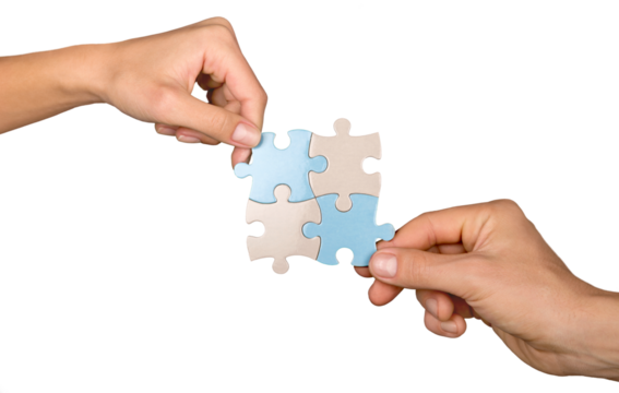 Closeup on Hands Combining Puzzle Pieces Together