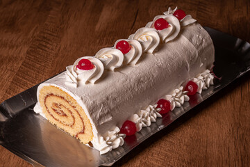 
roll cake with guava jam and crase with cherry