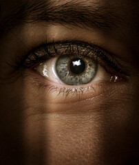 close-up of an eye in the shadows