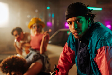 Fashionable man with friends in city.