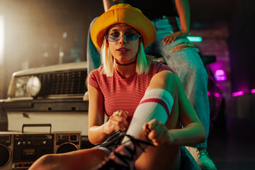 Cool retro skater girl tying laces.