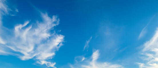 Blue sky with beautiful clouds. Wide photo.