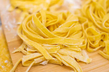 Close up of Pasta and Hands making home made Italian Pasta