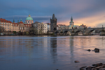 Fototapeta premium View of Prague's Old Town and Charles Bridge from the river level at sunset