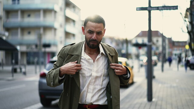 Successful Middle Eastern man celebrates achievement in the city streets, dancing and feeling carefreefee and joy