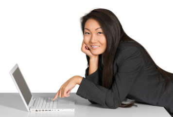 Beautiful asian businesswoman using laptop isolated on white