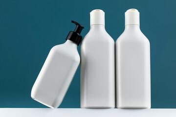 A set of cosmetic bottles on a white shelf with a place for your logo. routine body and hair care, toiletries.