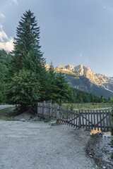 Scenery of famous mountain village Theth in Theth Valley, on background the mountains of Albanian Alps