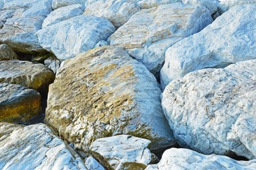 A pile of large marble boulders