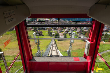 Funicular travelling up mountain from Murren to Allmendhubel, Switzerland in the summer