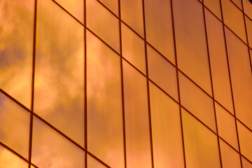 sunset reflection in the windows of the building. part of the building - Powered by Adobe