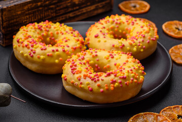 Delicious fresh donuts in yellow glaze with lemon flavor filling