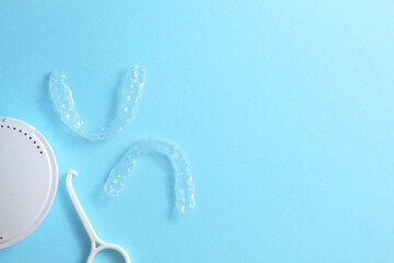 Aligners for straightening teeth on a blue background