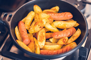 Fried sausages with potatoes