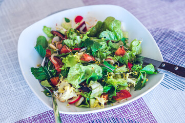 Salad with cherry tomatoes and radish
