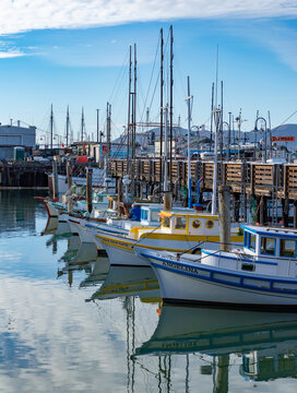 San Francisco, United States - November 25, 2022: A picture of the colorful boats at the San Francisco Fisherman's Wharf.