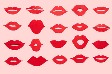 Red paper lips on pink background