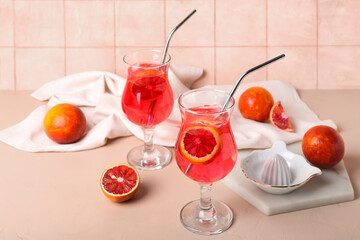 Glasses of tasty blood orange lemonade on table