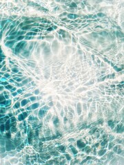 Blue water with ripples on the surface. Defocus blurred transparent blue colored clear calm water surface texture with splashes and bubbles. Water waves with shining pattern texture background.