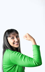 Young woman flexing her bicep on a white background.