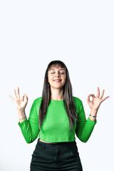 Pretty girl doing zen gesture over white background. Healthy lifestyle concept