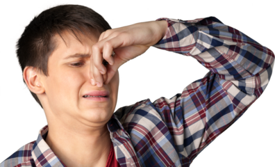 Young man pinching his nose